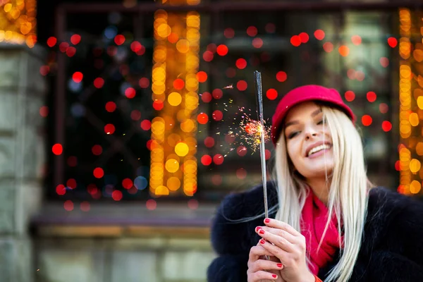 Pleased Blonde Woman Celebrating Christmas Sparklers Bokeh Background Empty Space — Stock Photo, Image