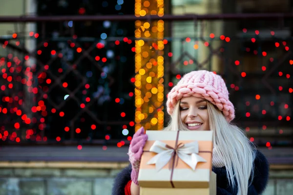 Pleased Blonde Girl Wearing Knitted Cap Warm Coat Opening Gift — Stock Photo, Image