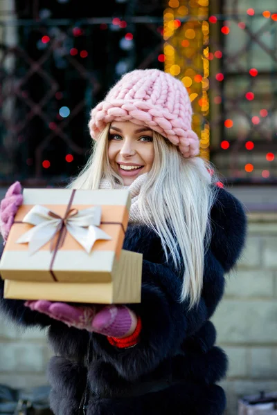 Emotional Blonde Woman Wearing Knitted Cap Warm Coat Opening Gift — Stock Photo, Image