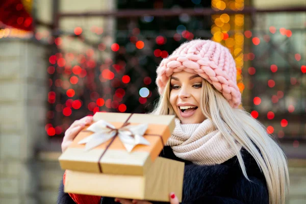 Joyful Blonde Girl Wearing Knitted Cap Warm Coat Holding Gift — Stock Photo, Image