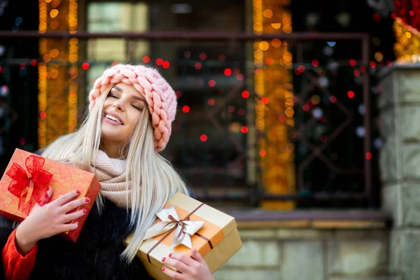 Happy Blonde Woman Dressed Warm Outfit Holding Gift Boxes Background — Stock Photo, Image