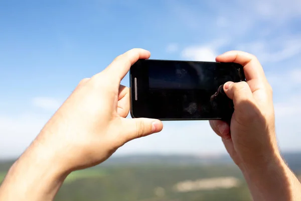 Male Hands Holding His Mobile Phone Outdoor Records Video Landscape — Stock Photo, Image