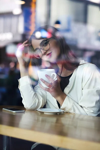Lovely young woman wearing glasses spending time in the restaura — Stock Photo, Image
