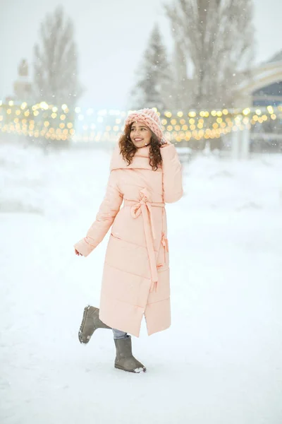 Winter shot of cheerful woman wearing pink coat — Stock Photo, Image
