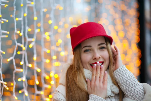 Cheerful girl covering her mouth by hand — Stock Photo, Image