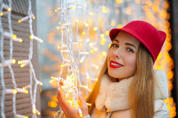 Adorable blonde girl wearing red hat — Stock Photo, Image