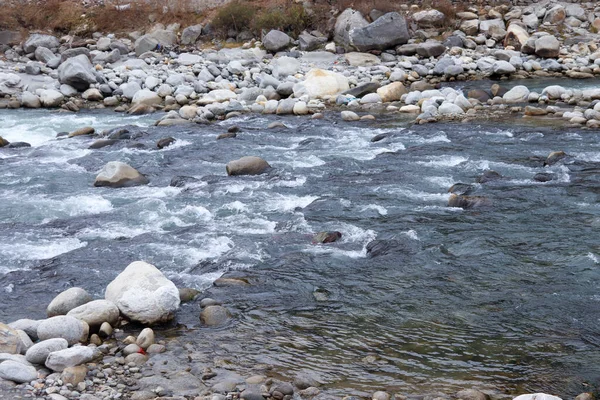 flowing river having rocks in the river