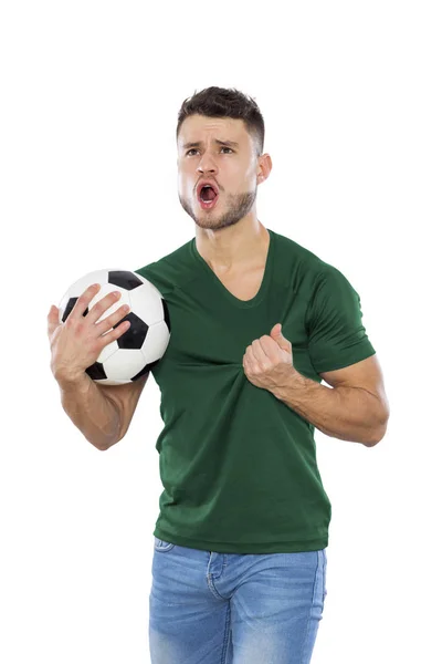 若いですサッカーファンとともに緑のシャツボールで手に白の背景 — ストック写真