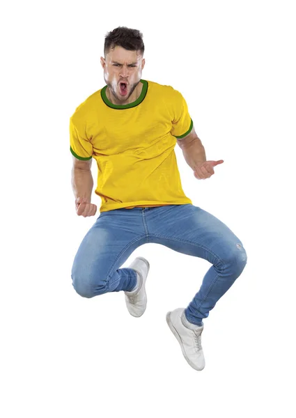 Jovem Musculoso Com Camisa Amarela Verde Pulando Celebrando Triunfo Sua — Fotografia de Stock