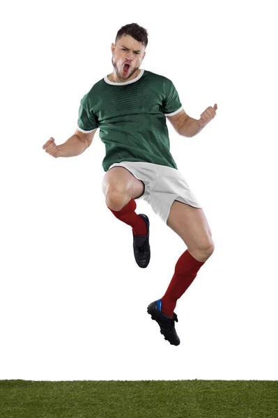 Молодой Футболист Траве Зеленой Рубашке Прыгает Кричит Эмоциями Белом Фоне — стоковое фото
