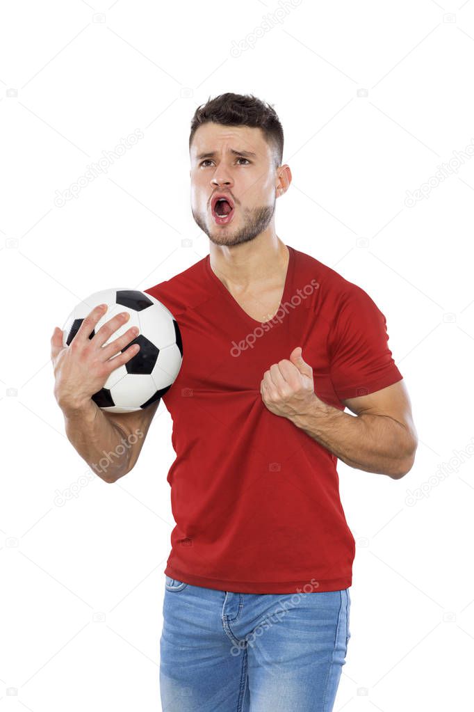 Young soccer fan with red shirt ball in hands on white background