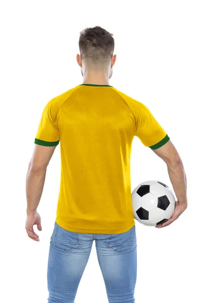 年轻的球迷背部黄色和绿色的衬衫球在白色背景手 — 图库照片