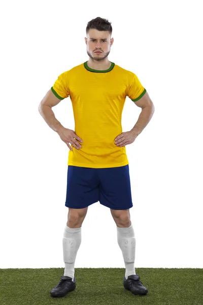 白い背景の上の黄色と緑のシャツで若いサッカーファン — ストック写真