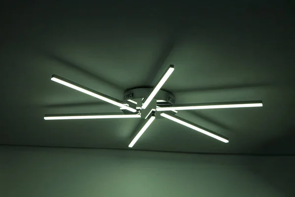 Modern decorative lamp supported by ceiling in house