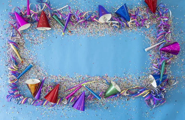 Party of confetti and caps with streamers and trumpets