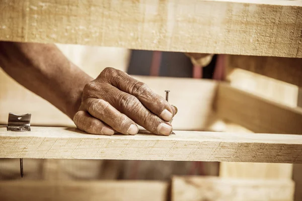 Man hands working in furniture wood industry