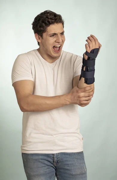 Young Man Immobilizer Hand Injuries Bones Muscles Expression Pain Face — Stock Photo, Image