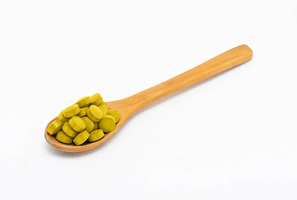 Compresse Medicinali Vitamine Integratori Alimentari Colore Giallo Con Cucchiaio Legno — Foto Stock