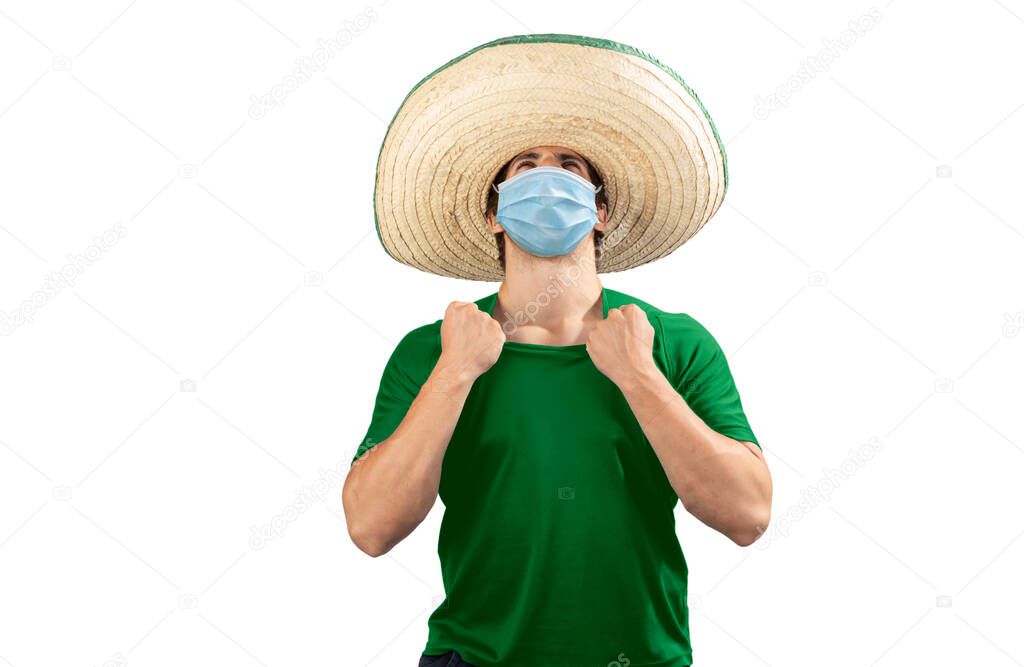 Mexican with a green soccer shirt and a mask with a shout of excitement for national holidays.