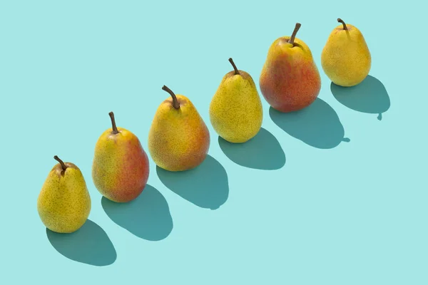 Multiple Pears Organized Row Blue Background — Stock Photo, Image