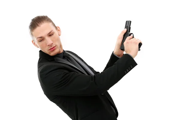 Hombre Guapo Con Traje Negro Una Pistola Posando Sobre Fondo —  Fotos de Stock
