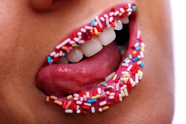 a woman mouth with candy inside
