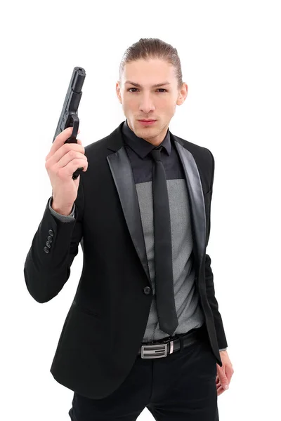 Hombre Guapo Con Traje Negro Una Pistola Posando Sobre Fondo —  Fotos de Stock