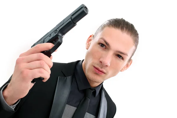 Homem Bonito Terno Preto Uma Pistola Posando Sobre Fundo Branco — Fotografia de Stock