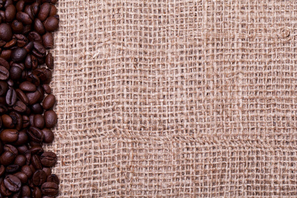 Coffee beans over cloth sack texture