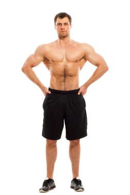 Beyaz bir arka plan üzerinde çıplak gövde izolasyonu olan yakışıklı kaslı adam.