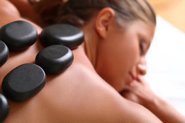 Portrait Beautiful Caucasian Woman Spa Stones Her Back — Stock Photo, Image