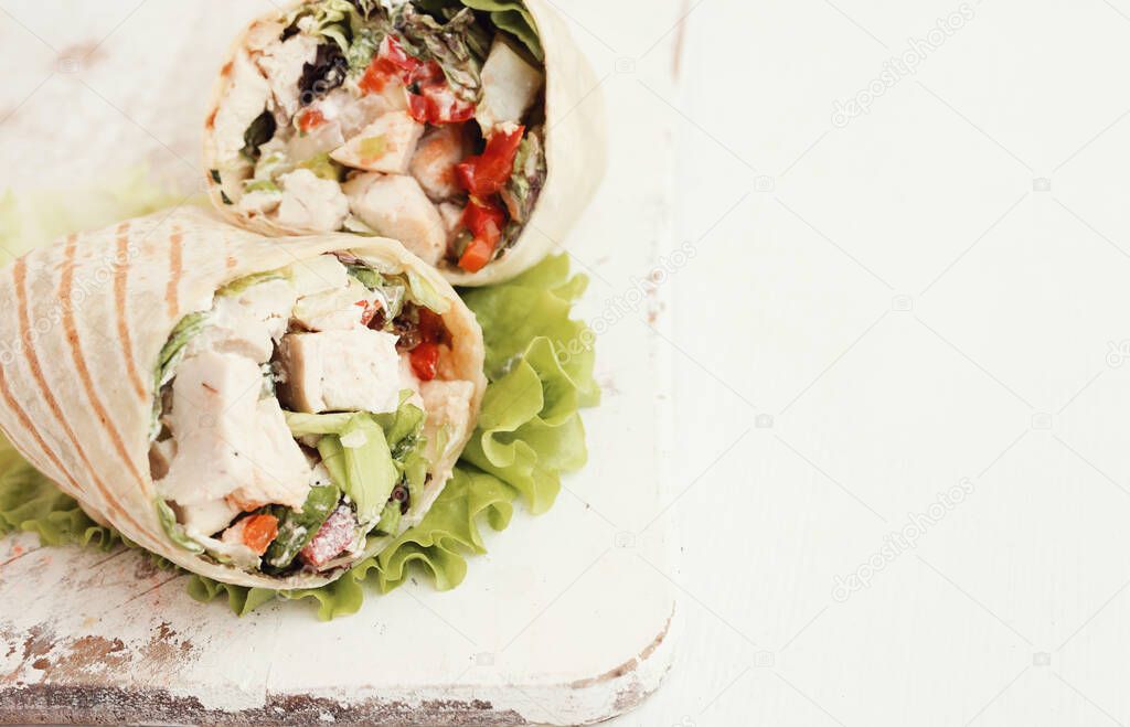 Healthy food. Delicious chicken wrap with vegetables