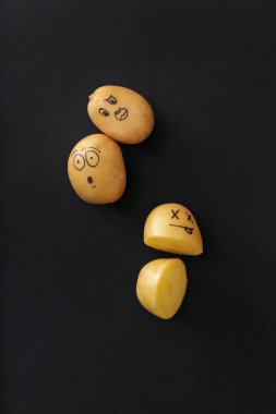 - Sanat. Siyah arka planda komik bir patates