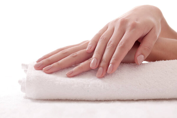 Skincare. Soft and clean hands on a white towel