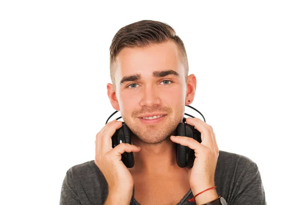 英俊的男人用耳机在白色背景的肖像 — 图库照片