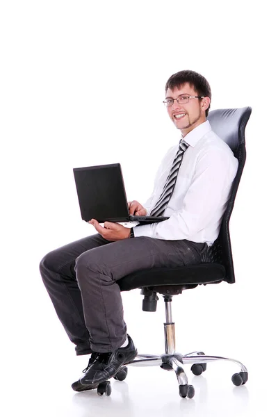 快乐商人在椅子上用白色背景上的笔记本电脑 — 图库照片
