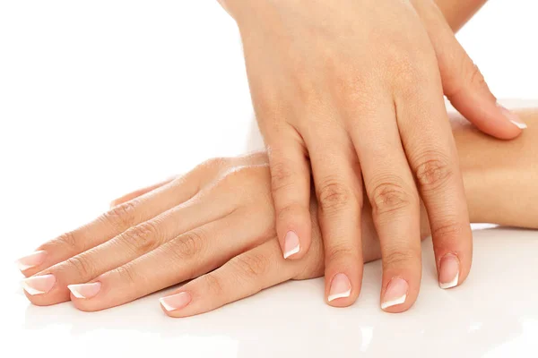 Mujer Joven Manos Con Manicura Francesa Sobre Fondo Blanco —  Fotos de Stock