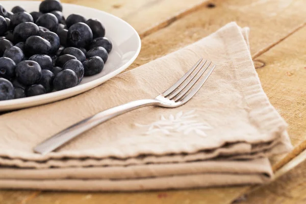 Lots Blueberries Plate Fork Napkin Wooden Surface — Stock Photo, Image