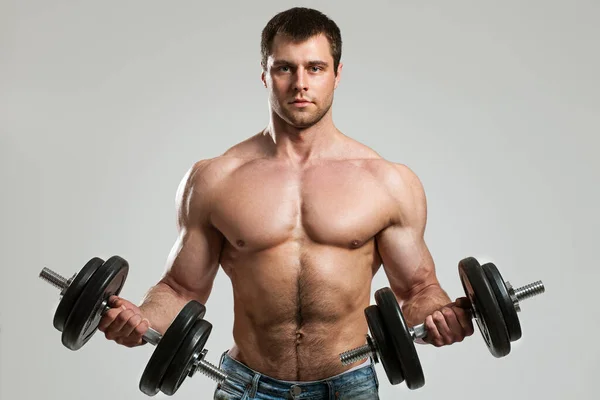 Handsome Guy Working Out Dumbbells Isolated Grey Background — Stock Photo, Image