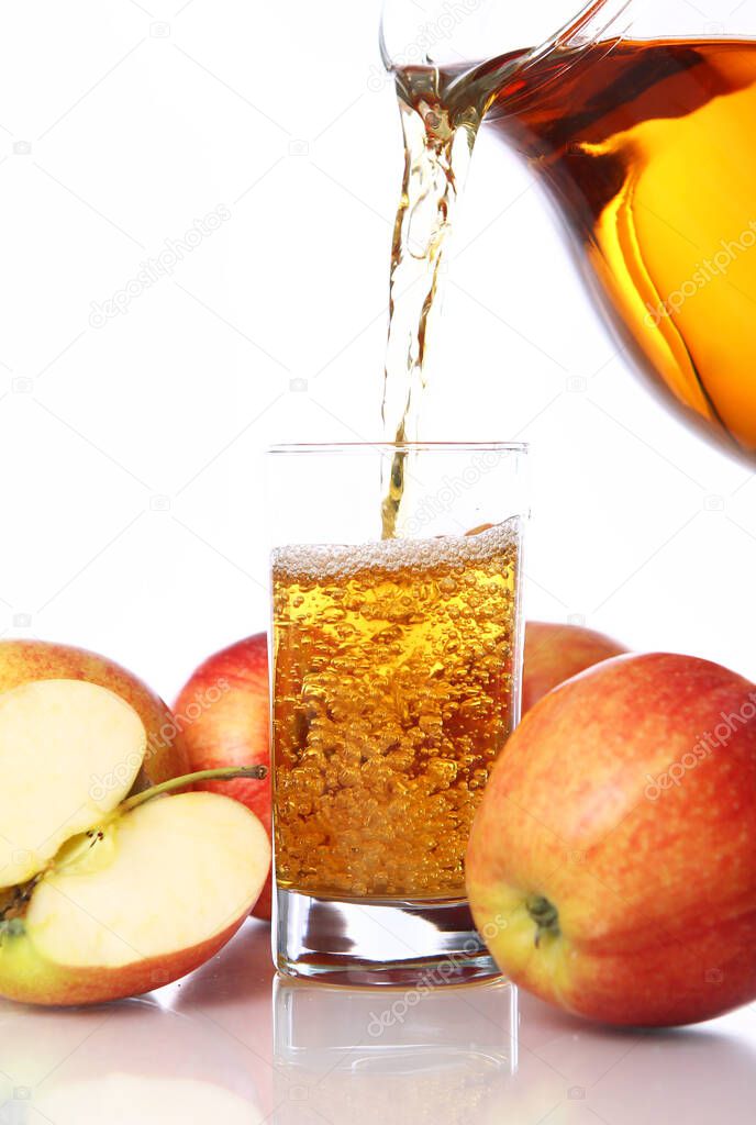 Fresh and cold apple juice against white background