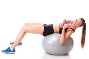 genç ve mutlu bir kız dumbbells ile yapıyor