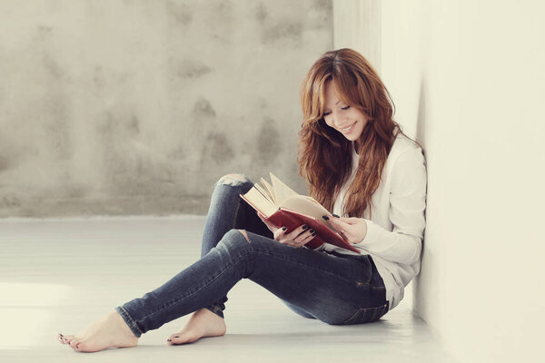 Lovely woman study on the floor