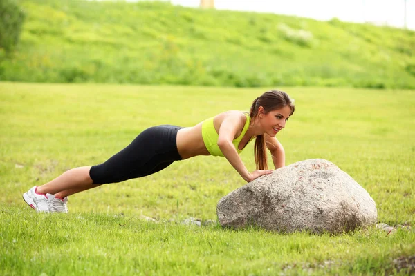 Beautiful Young Woman Working Out Stone Outdoors — Stock Photo, Image