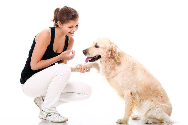 Happy woman and her beautiful dog over white background