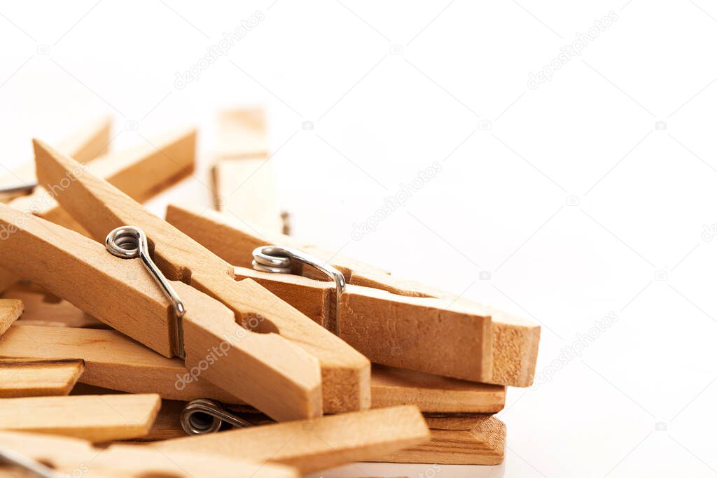 Closeup image of eco wooden clothespins on a white background