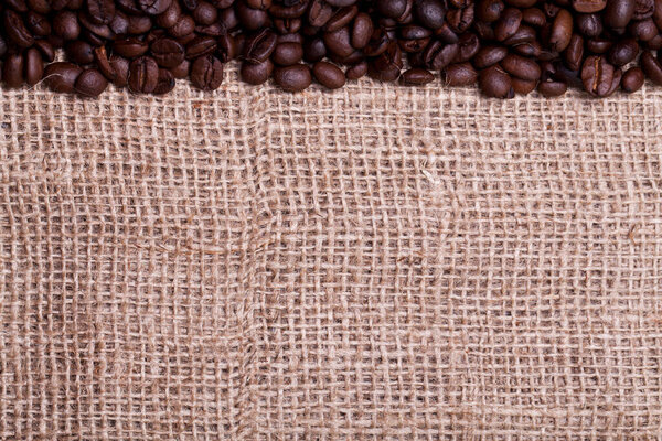 Coffee beans over cloth sack texture