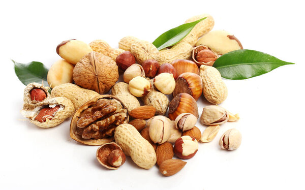 Close up of fresh nuts against white background 