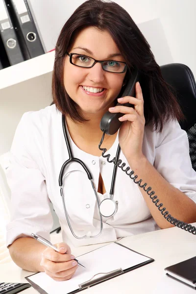 Young Woman Doctor Talking Phone Her Office Royalty Free Stock Photos