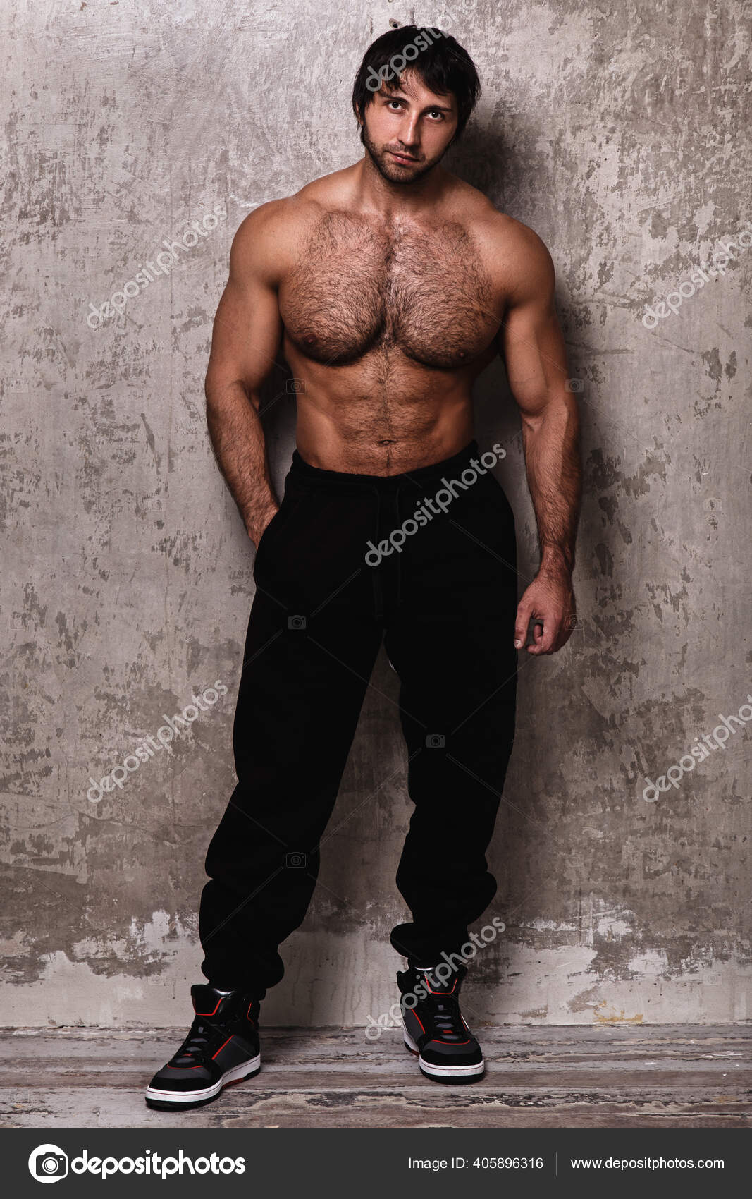 Bodybuilder Man Hairy Chest Stock Photo by racool studio 405896316