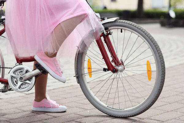 Street. Woman with bicycle outdoor